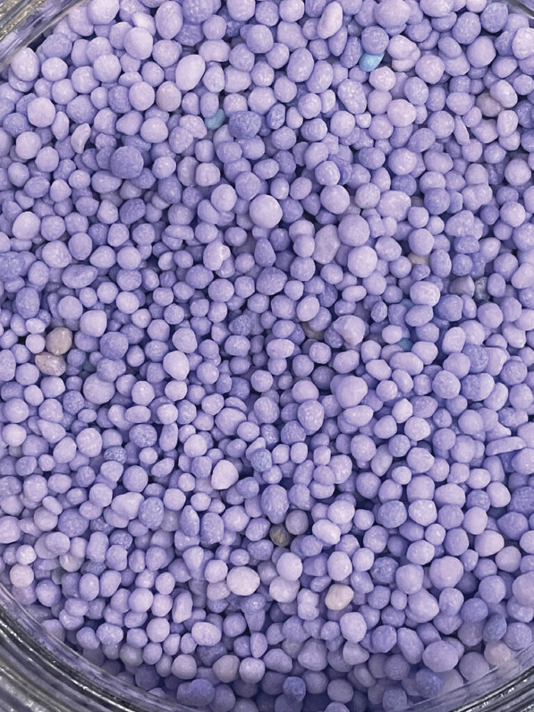 Purple TSN stabilized urea granules, photographed for the Taurus 2027 Product Guide.